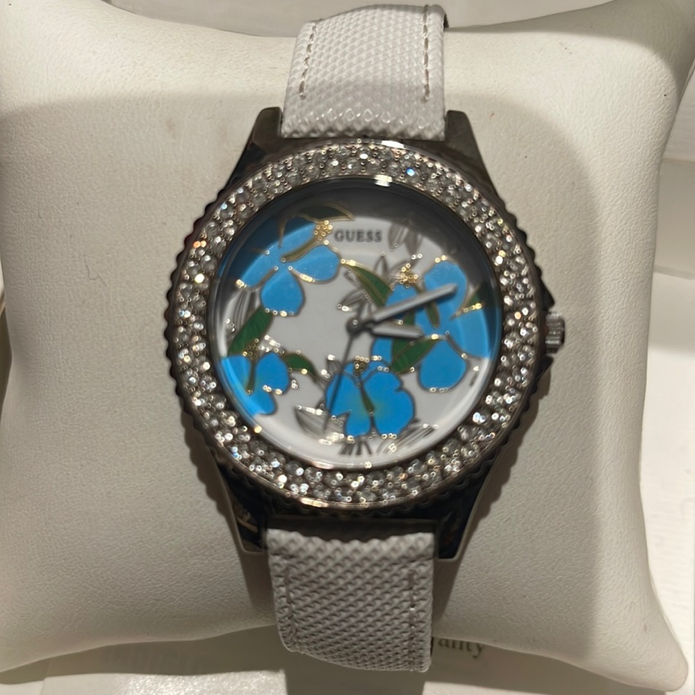white and blue guess wristwatch